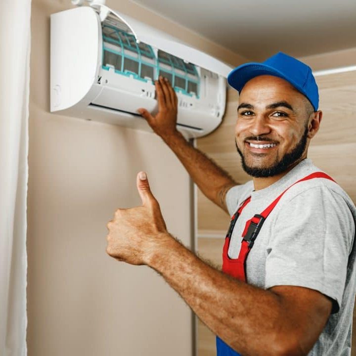 professional-repairman-installing-air-conditioner-in-a-room.jpg
